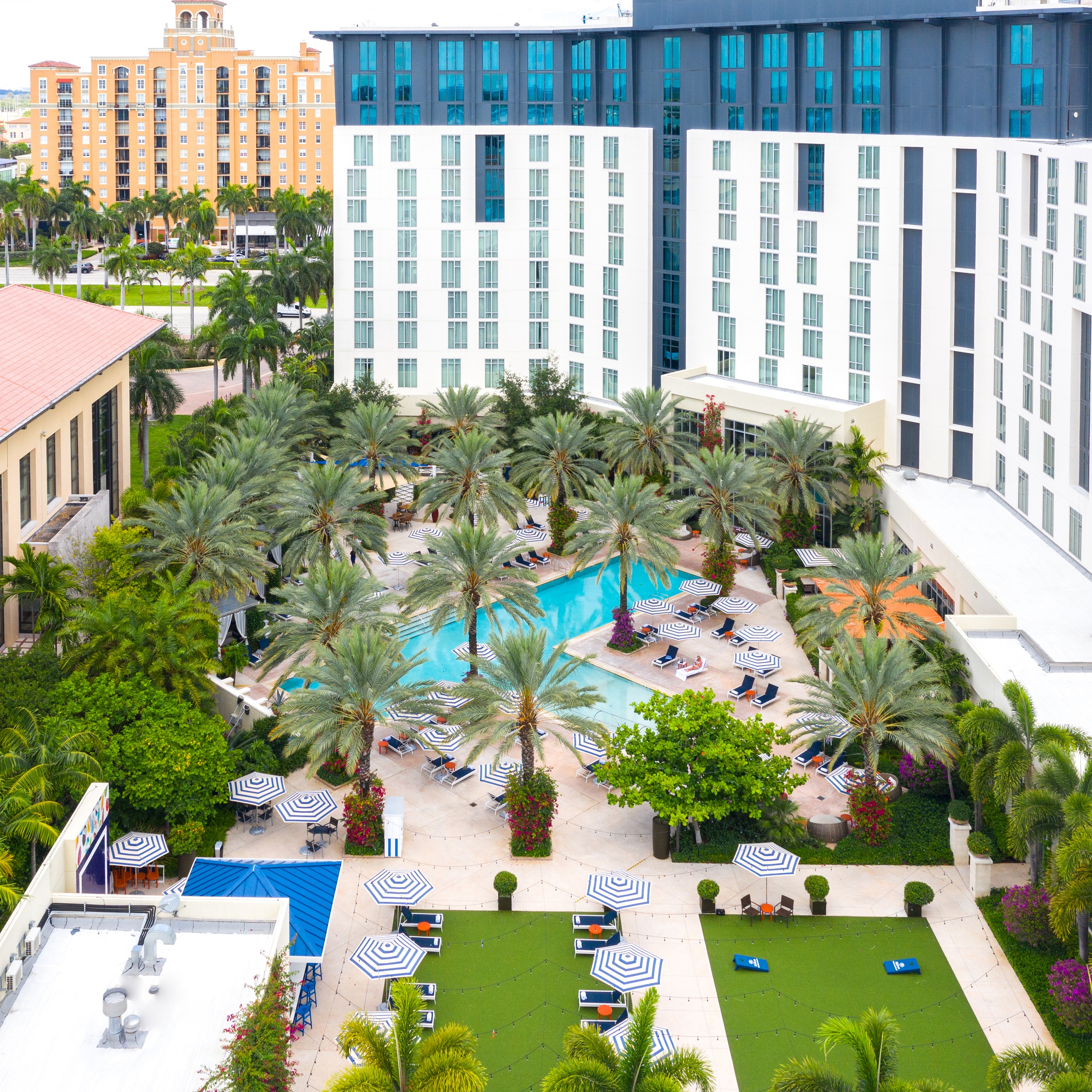 Aerial photo of hotel pool and green lawn