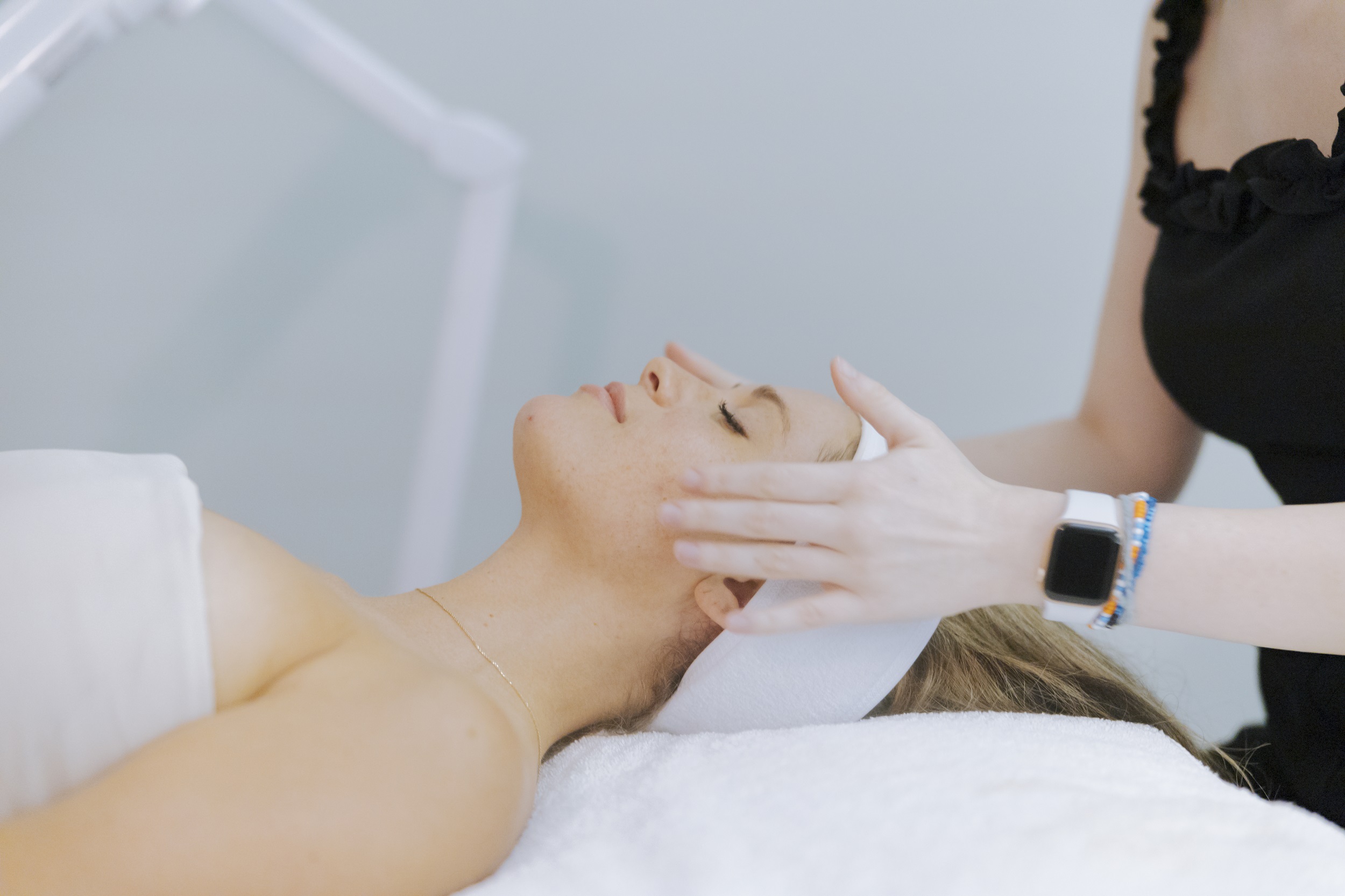 Woman enjoying facial at spa