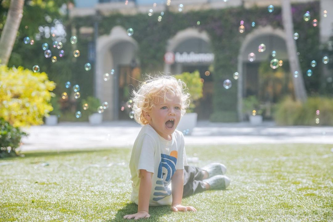 little boy playing with bubbles