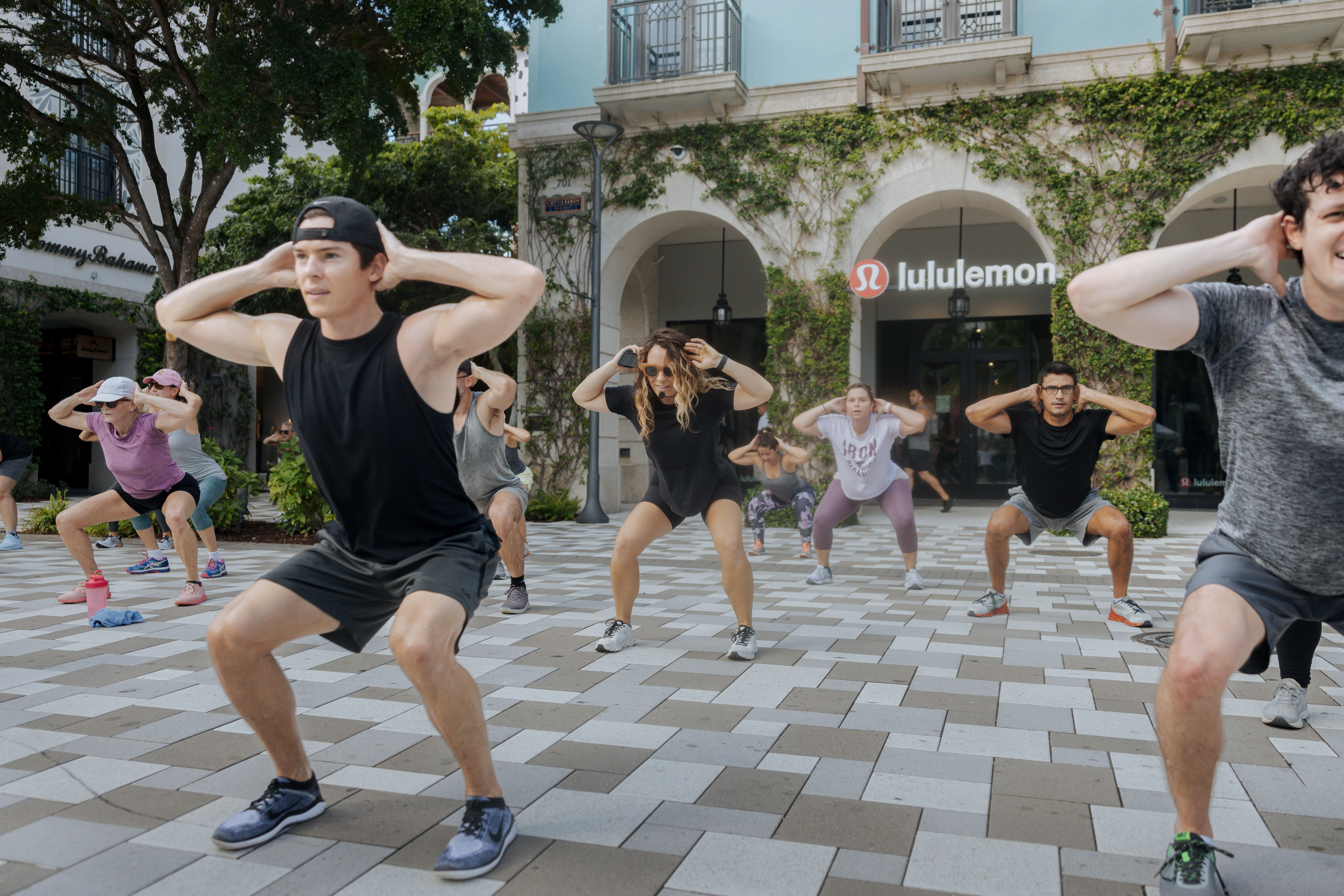 people stretching in front of lululemon