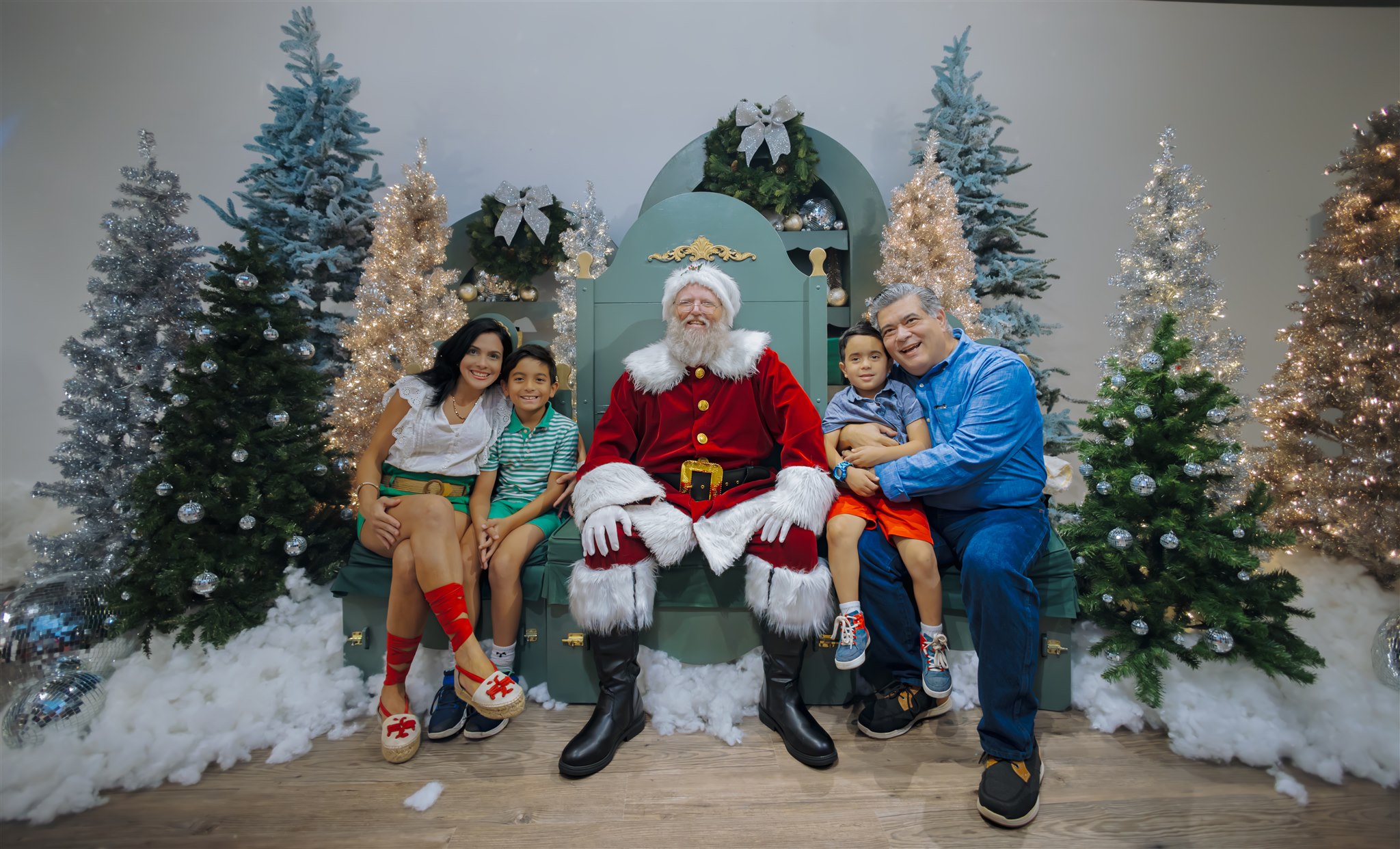 Family taking a photo with Santa