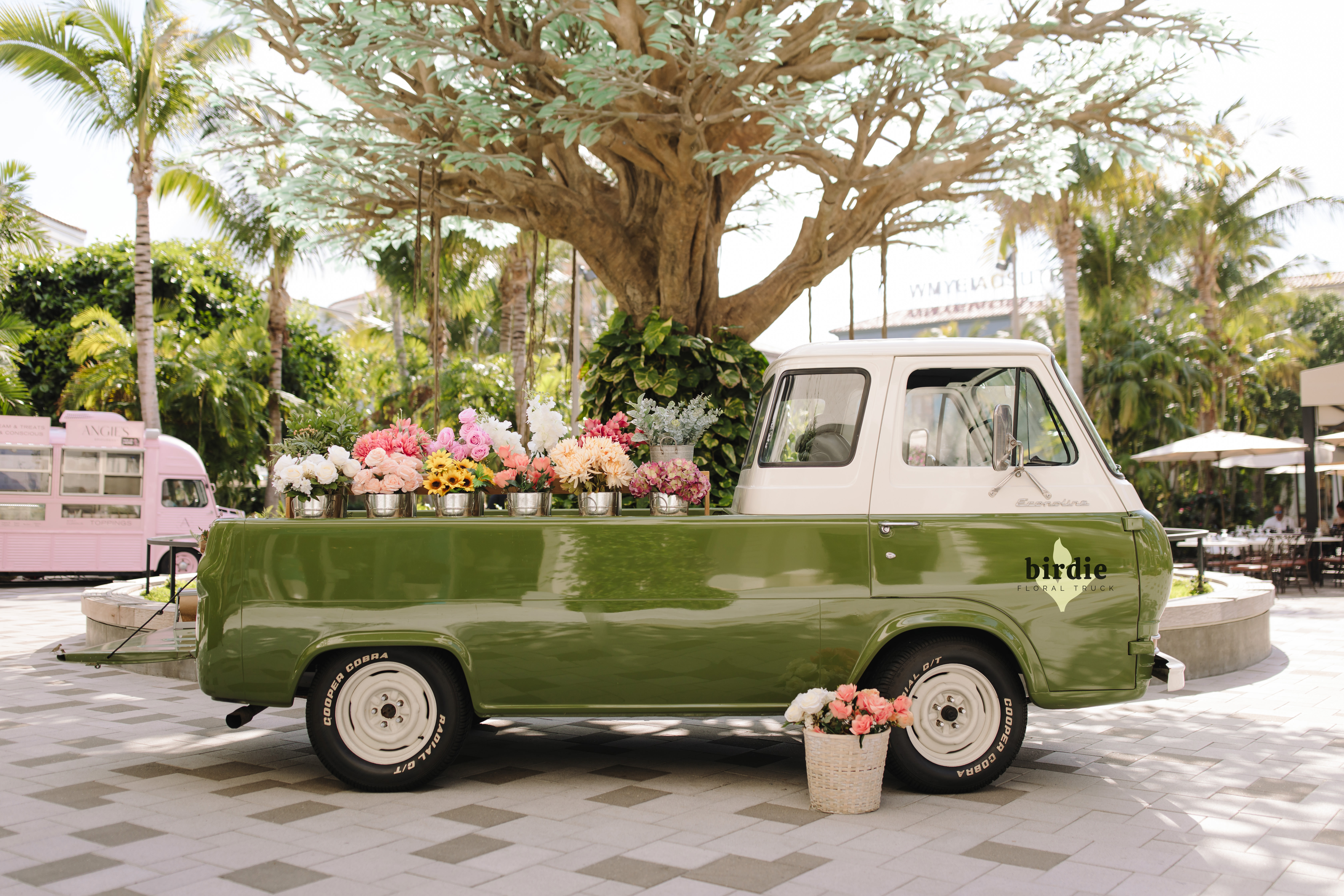 Green Truck with flowers in the bed 