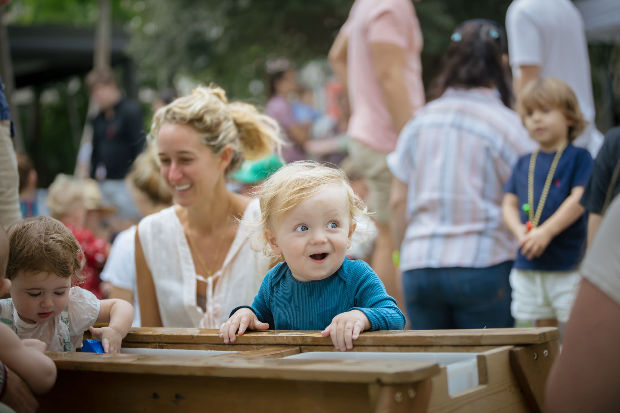 Child playing in a water table