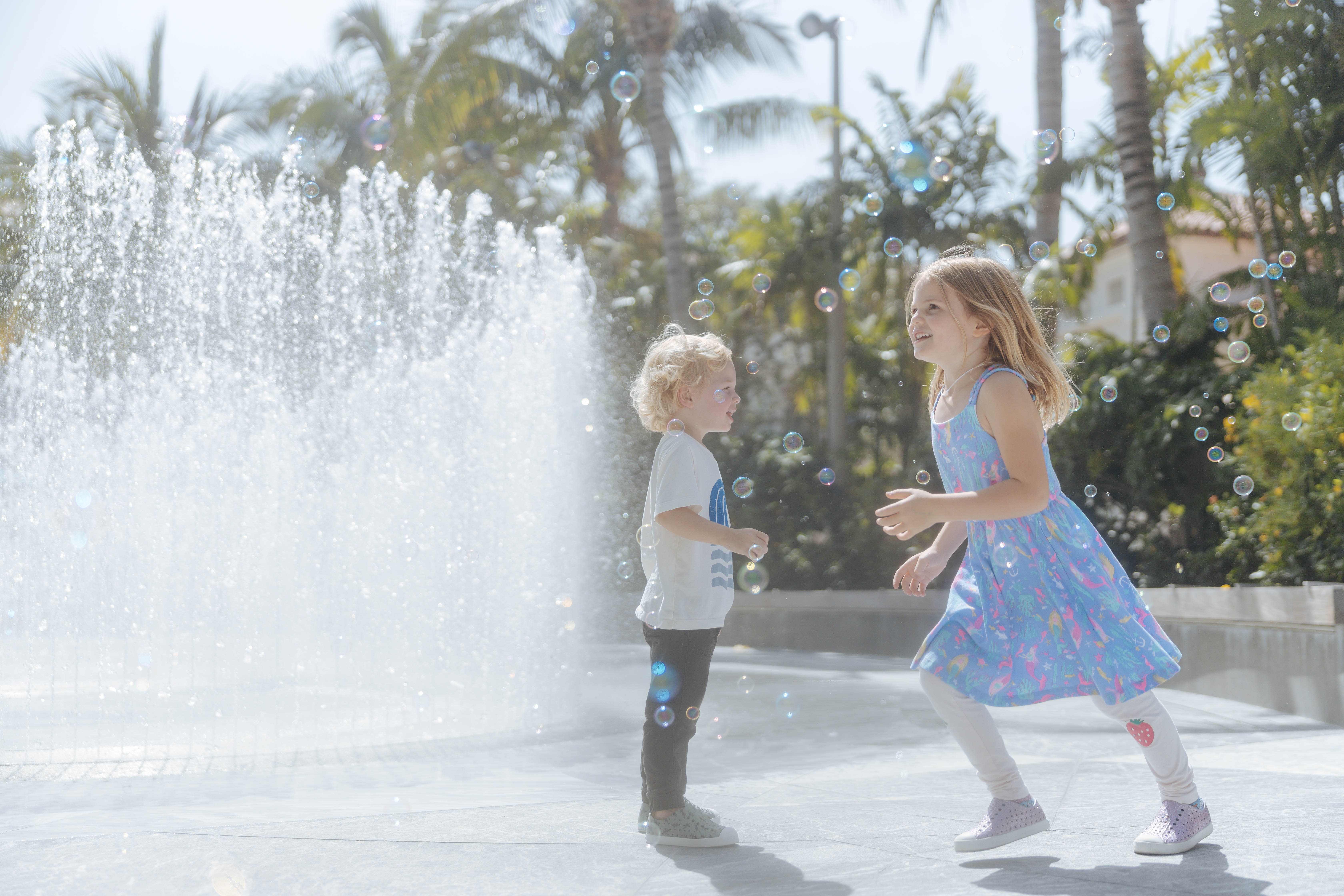 Kids playing in bubbles