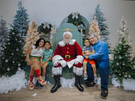 Family taking a photo with Santa