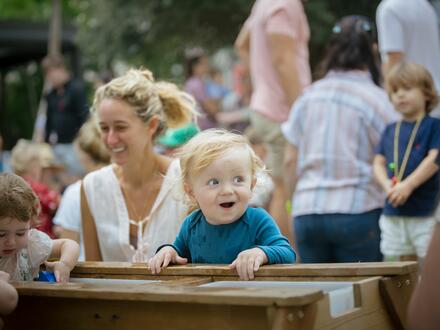 Child playing in a water table