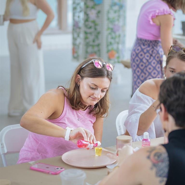 Individual making a candle