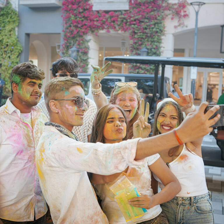 group of people posing for a selfie 